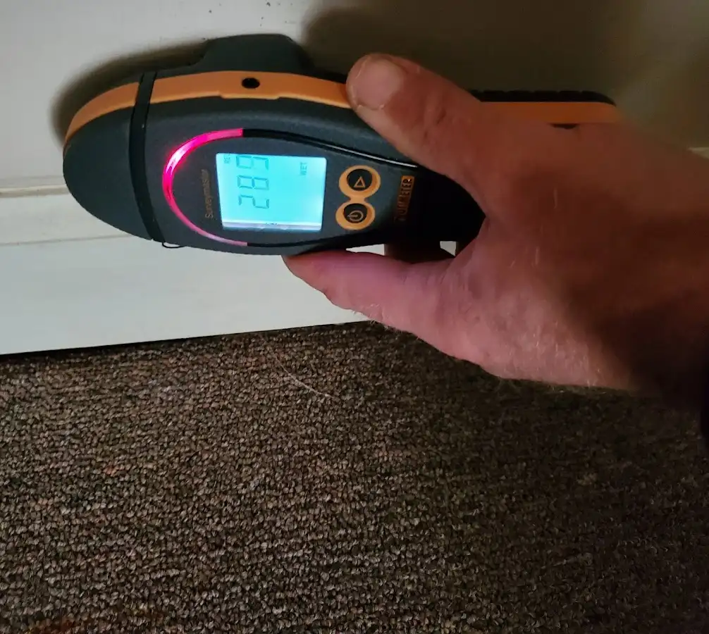 Moisture detection at baseboard during Storm Damage Restoration in Willowick